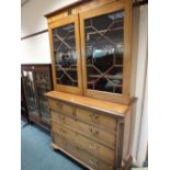 An early 19th century crossbanded mahogany chest of two short and three long drawers between canted