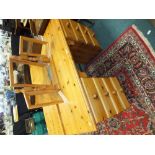 A modern pine pedestal dressing table with eight drawers and a pine triple dressing table mirror