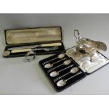 A cased set of six silver shell moulded teaspoons together with a silver sauce boat,