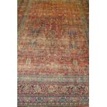 A large carpet possibly Isfahan (worn) approximately 512cm x 370cm