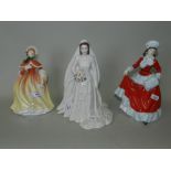Two Royal Doulton figures, Autumn HN5323 and Winter HN5314, together with a Royal Worcester figure,