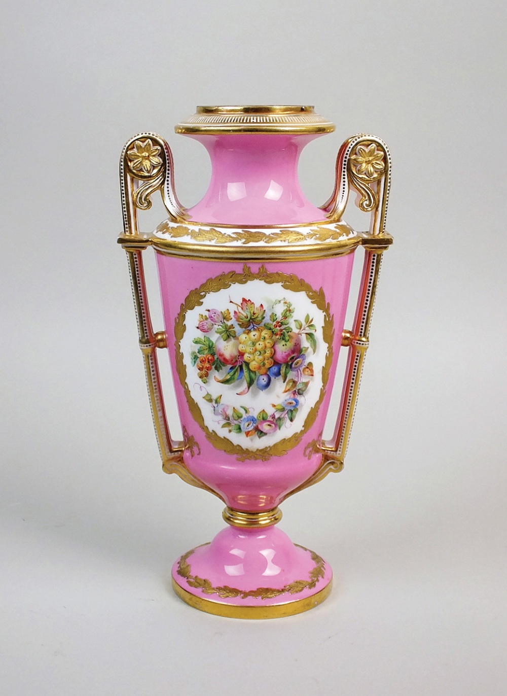 A Coalport porcelain pink ground two handled vase, ampersand mark for 1861-75,