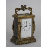 A French cast gilt brass carriage clock with push button repeat, retailed by Henry & Co, Paris,