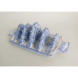 A blue and white earthenware toast rack, 19th century,