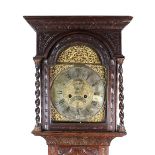 A George III oak longcase clock, later carved, the ogive moulded cornice,