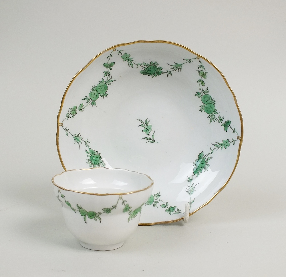 A Bristol hard paste porcelain ogee shape teabowl and saucer, circa 1775,