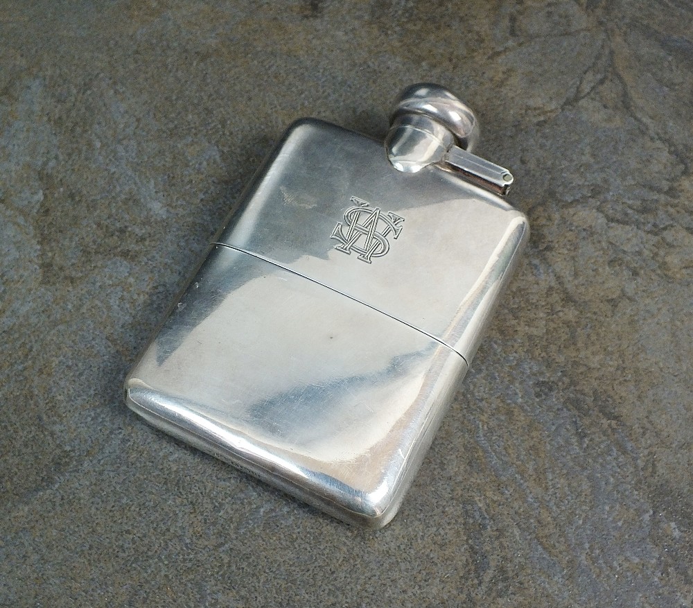 A silver hip flask, A J Zimmerman, Birmingham 1919,