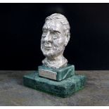 A cast silver bust of L.S. Lowry by J.