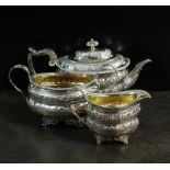 A matched three piece silver tea service,