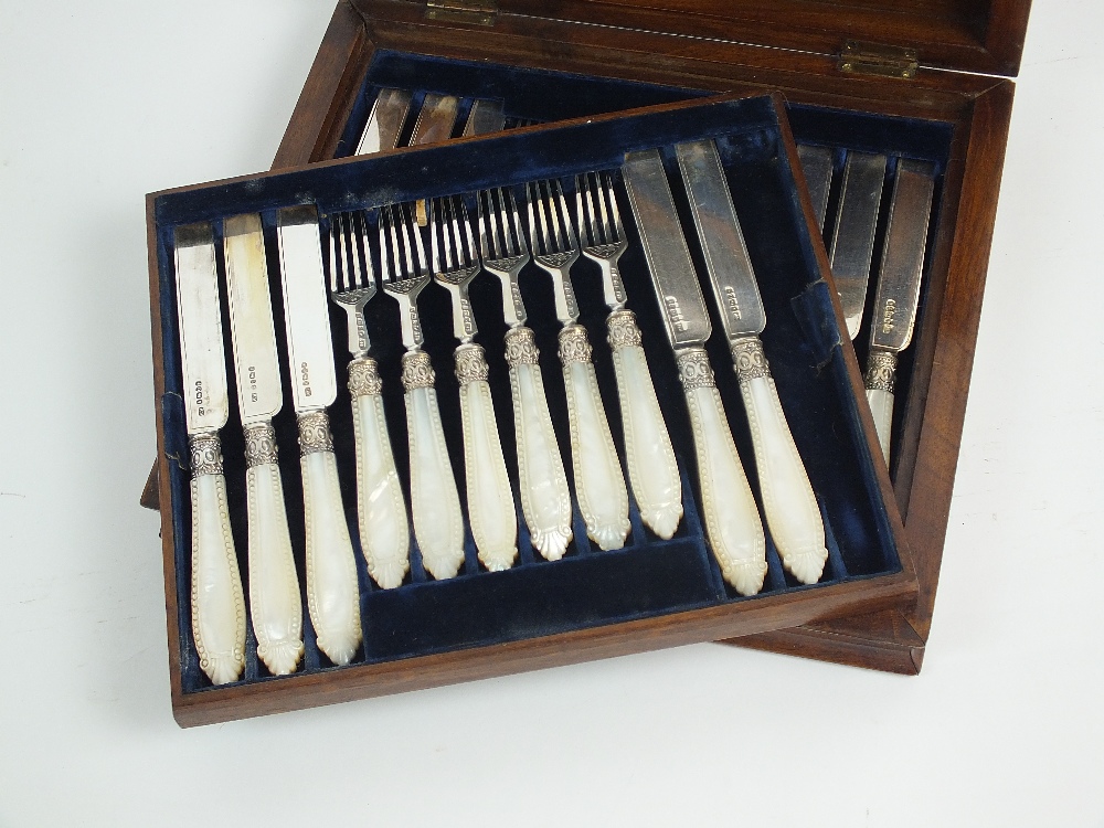 A cased part set of Victorian mother of pearl handled silver fruit knives and forks,