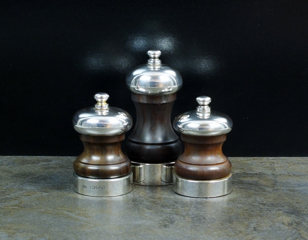 A pair of silver mounted turned wood pepper grinders, John Bull Ltd, London 1993 & 1994,