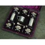 A cased Victorian nine piece silver cruet set, Horace Woodward & Co, London 1890,