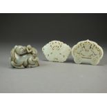 Two Chinese jade pendants, the first pale celadon and of ruyi form,