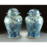 A near pair of Chinese blue and white jars and covers, 19th/20th Century,