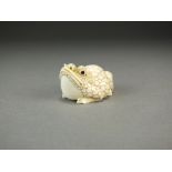 A Japanese ivory netsuke of a frog, Meiji period, naturalistically modelled with head raised, 4cm,