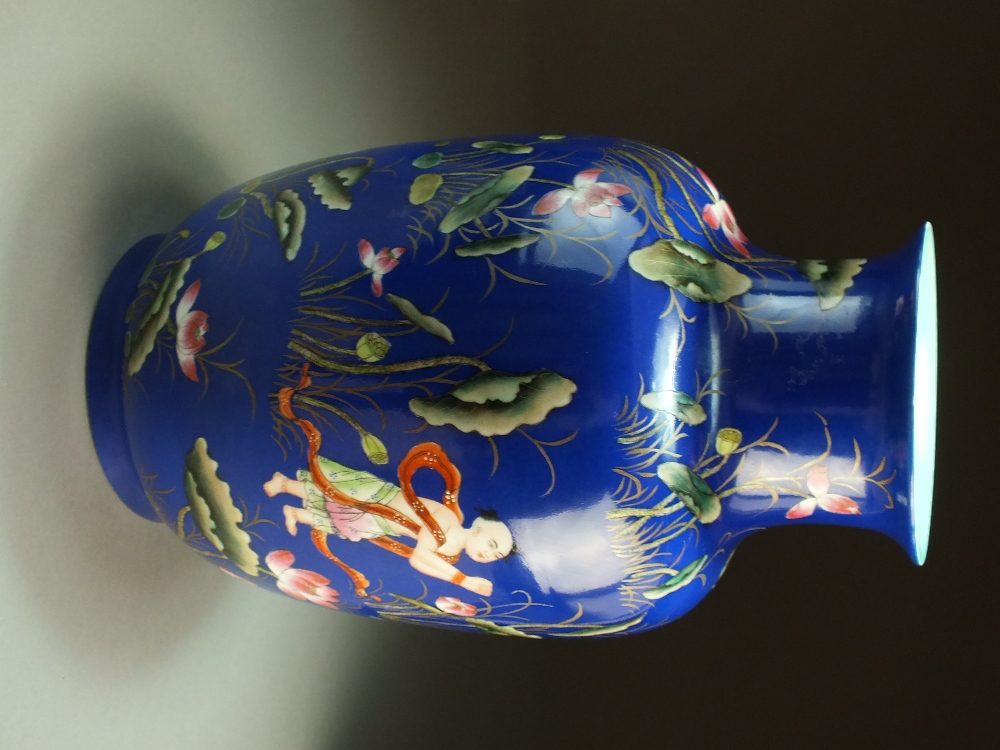 A Chinese powder blue ground famille rose vase, Qianlong seal mark but later, - Image 5 of 7