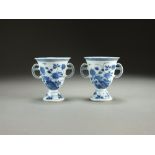 A pair of Chinese blue and white footed cups, late 18th/early 19th Century,