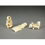 Two Japanese ivory netsuke, Meiji period, the first modelled as a man and boy playing go, 5cm long,