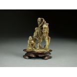 A Chinese carved soapstone figure group, 19th Century,