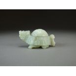 A Chinese pale green Jade figure of a mythical turtle, late Qing Dynasty, 10.5cm long.