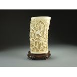 A Chinese Canton carved ivory reticulated tusk vase, Qing Dynasty,