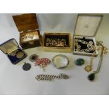 A collection of various pieces of costume jewellery to include a silver bangle,