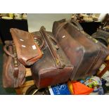 A leather Gladstone type bag together with another similar larger bag and two smaller leather bags