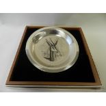 A cased Bernard Buffet silver plate engraved with the gazelle pattern,