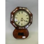An early 20th century mahogany drop dial wall clock the pair shaped case supporting an octagonal