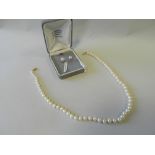 A cultured pearl necklace with yellow metal clasp and a pair of cultured pearl stud earrings