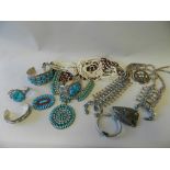 A collection of turquoise set silver South American jewellery together with a beaded belt