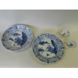 A Chinese porcelain blue and white bowl and plate decorated with hunting scenes within repeating