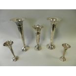 A pair of silver mounted posy vases hallmarked Chester together with three further posy vases