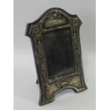 An early 20th century silver mounted photograph frame with tendril decoration