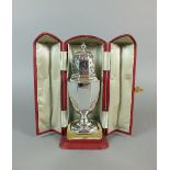 A cased silver sugar caster, Carrington & Co, London 1889,