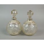 A pair of early 20th century silver mounted glass bottles, J H Worrall, Son & Co Ltd, London 1910,