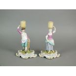 A pair of Meissen porcelain figural candlesticks, 19th century,