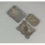 Two white metal filigree card cases,