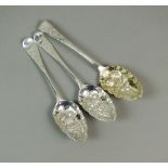 A pair of George II silver spoons, London 1758, with later embossed fruit decoration,