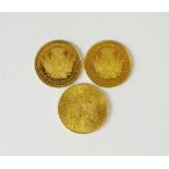 Three gold coins, comprising; an Austrian 20 Corona, dated 1915 and two Maria Theresa ducats,