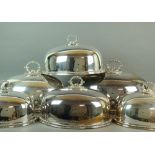 A graduated set of six silver plated dish covers,