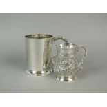 A George III silver baluster mug, London 1792, with later embossed decoration, 10cm high,