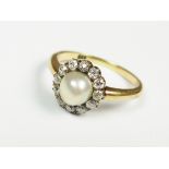 A pearl and diamond cluster ring,