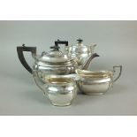 A three piece silver tea service, Emile Viner, Sheffield 1939, comprising; a teapot, 15cm high,