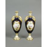A pair of Coalport cobalt and gilt two handled pear shaped vases, early 20th century,