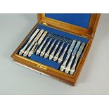 A Victorian cased part set of silver fruit knives and forks, Henry Wilkinson & Co, Sheffield 1856,