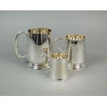 A silver mug, Barker Brothers Silver Ltd, Birmingham 1929, of plain polished form, 12.