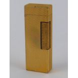 A Dunhill gold plated cigarette lighter, approx 6.5cm high.