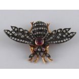 A 19th Century French hallmarked 18 carat gold gem and diamond set insect brooch, silver settings,