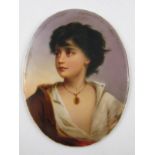 An oval porcelain plaque finely painted with the bust of an attractive tousle-haired young girl in